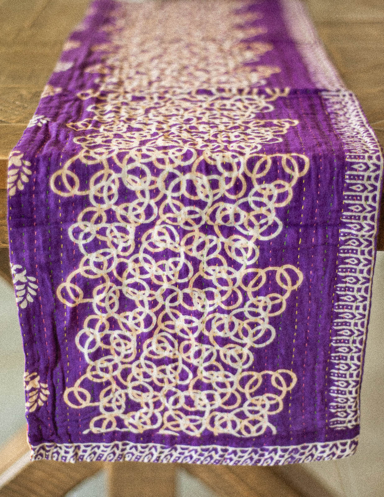 Dignify Cotton Table Runner in Cotton Kantha on a table