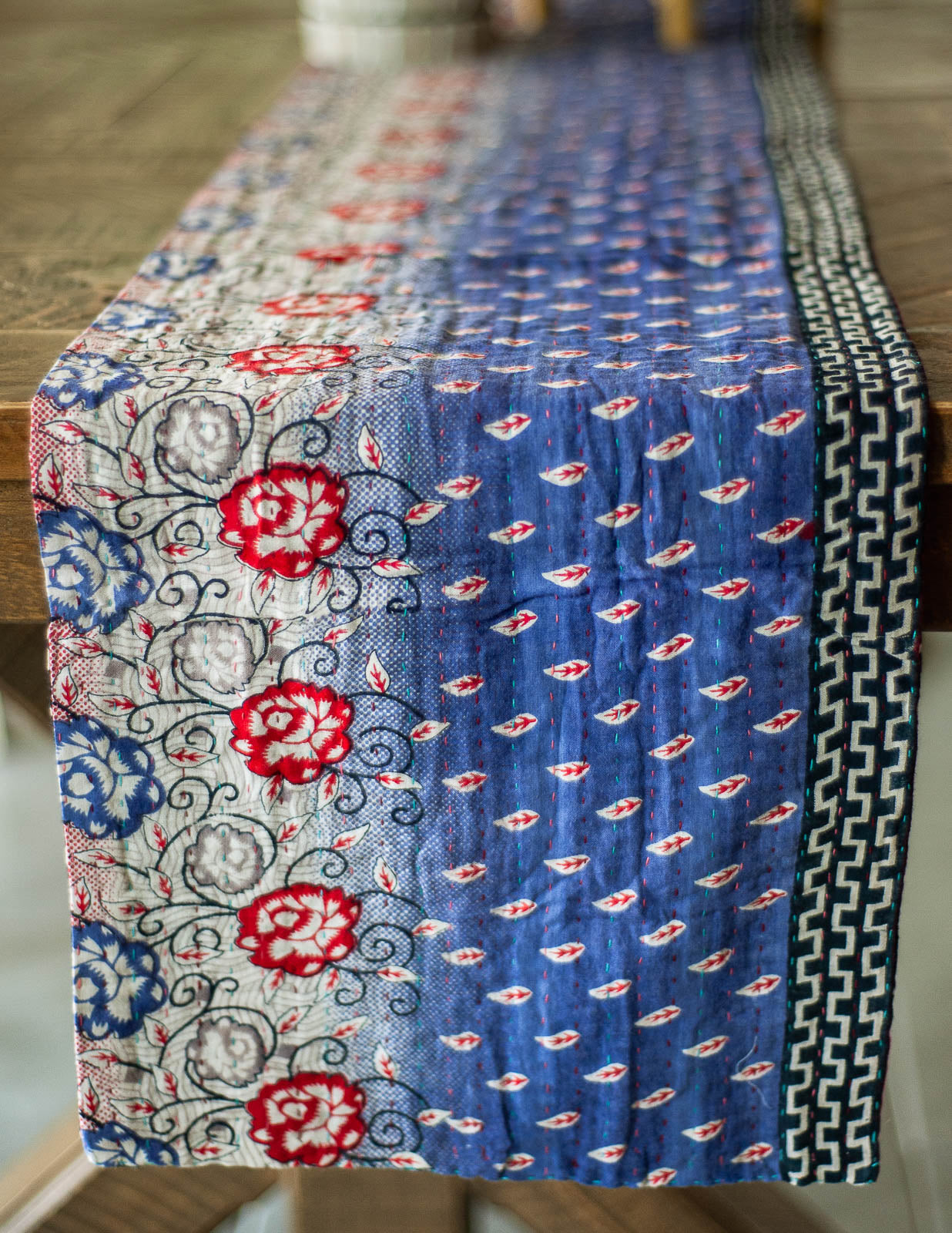 Dignify Cotton Table Runner in Cotton Kantha on a table