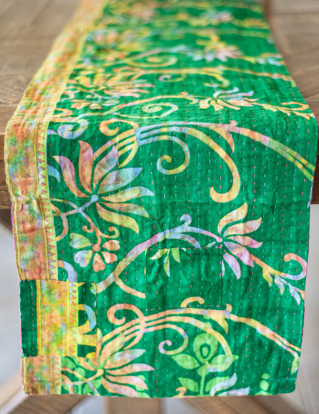 Dignify Cotton Table Runner in Cotton Kantha on a table