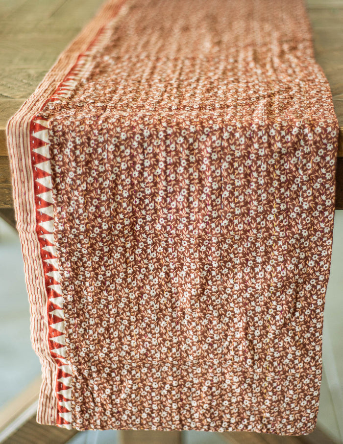 Dignify Cotton Table Runner in Cotton Kantha on a table