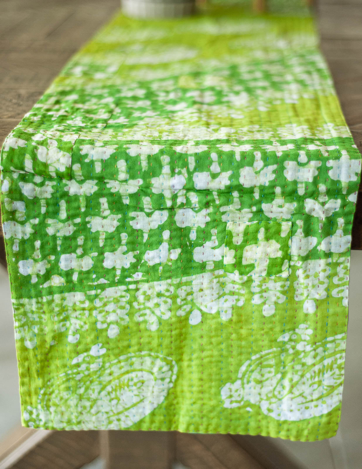 Dignify Cotton Table Runner in Cotton Kantha on a table